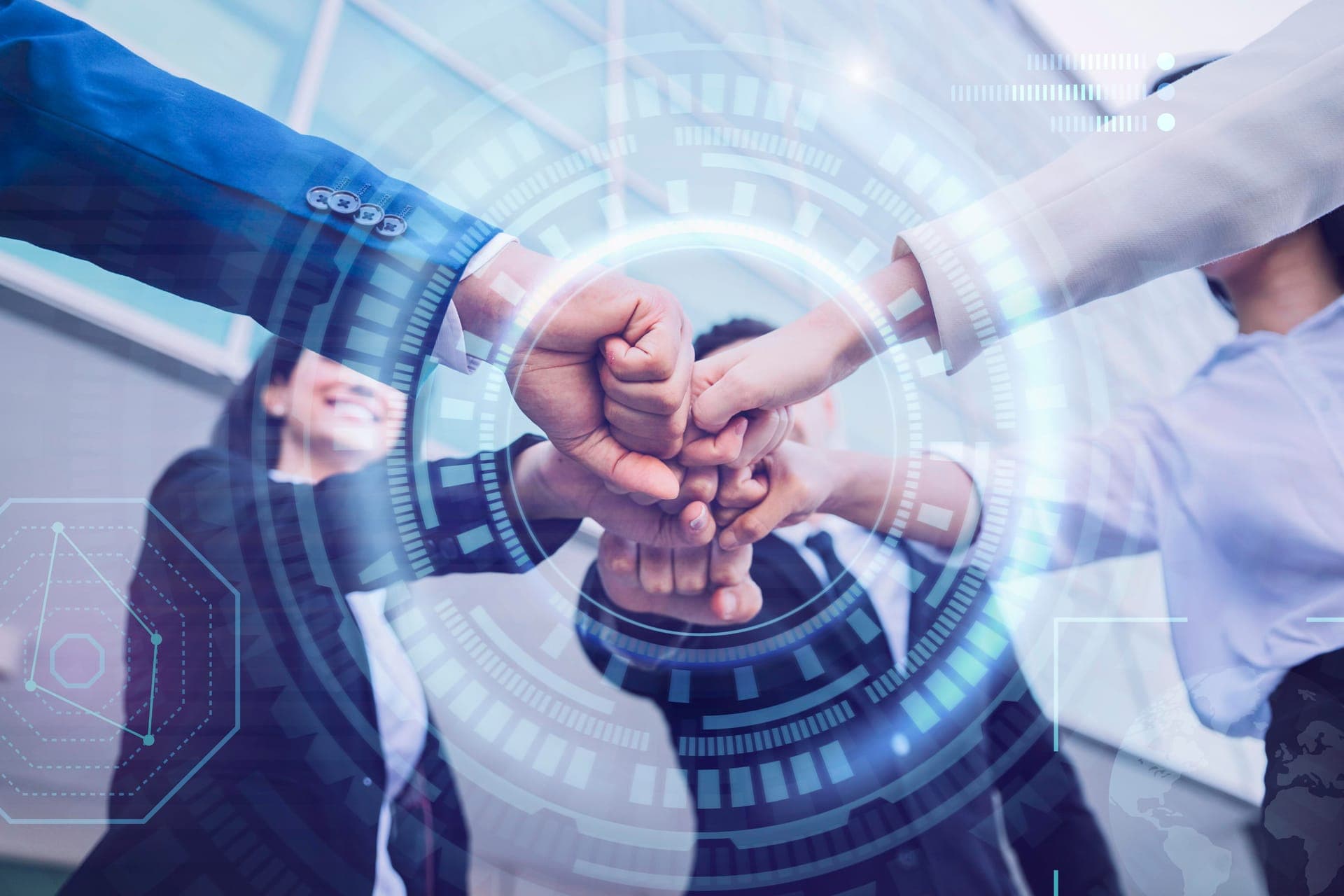 A team bringing their hands together in collaboration